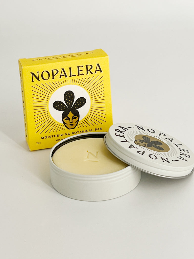 Nopalera Moisturizing Botanical Bar, a solid moisturizing body bar for deep hydration to the skin. Box and opened container.